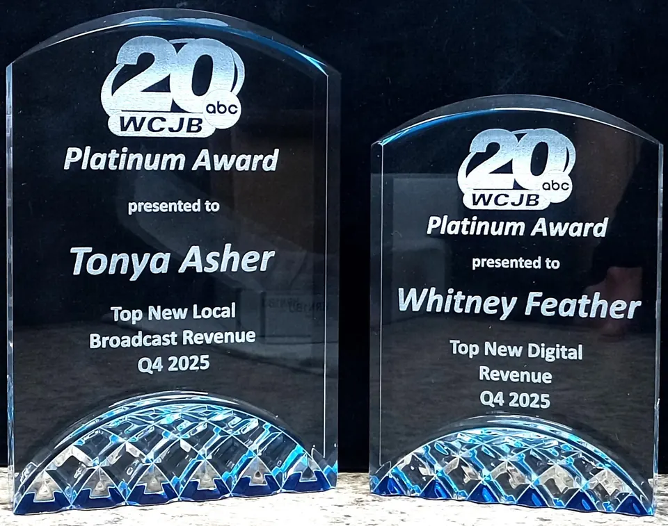 Two acrylic Platinum sales awards with engraved names