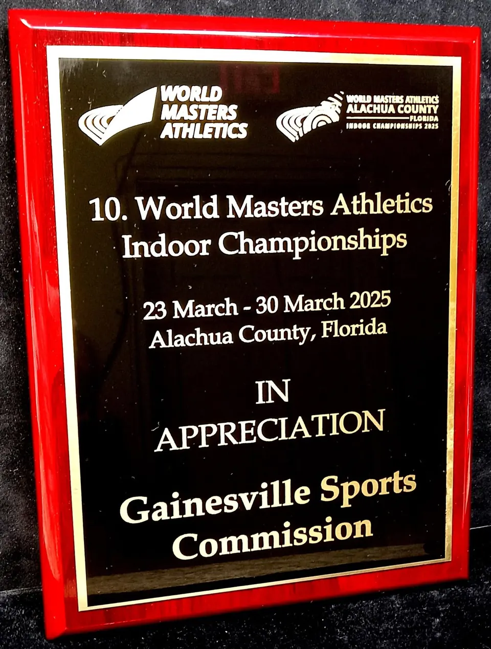 Red piano-finish appreciation plaque for an athletics championship