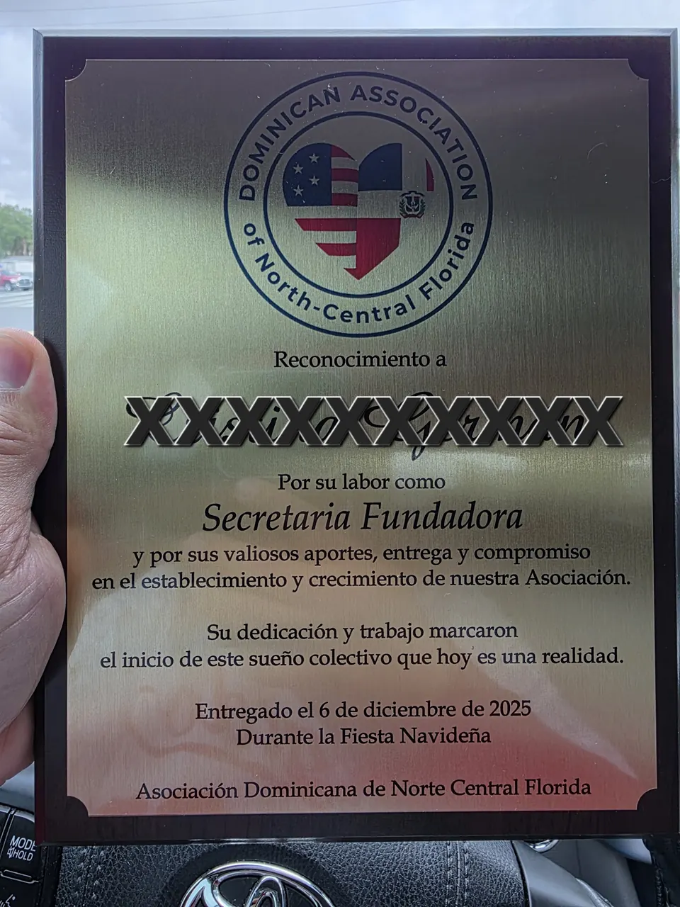 Silver recognition plaque engraved in Spanish for a community association