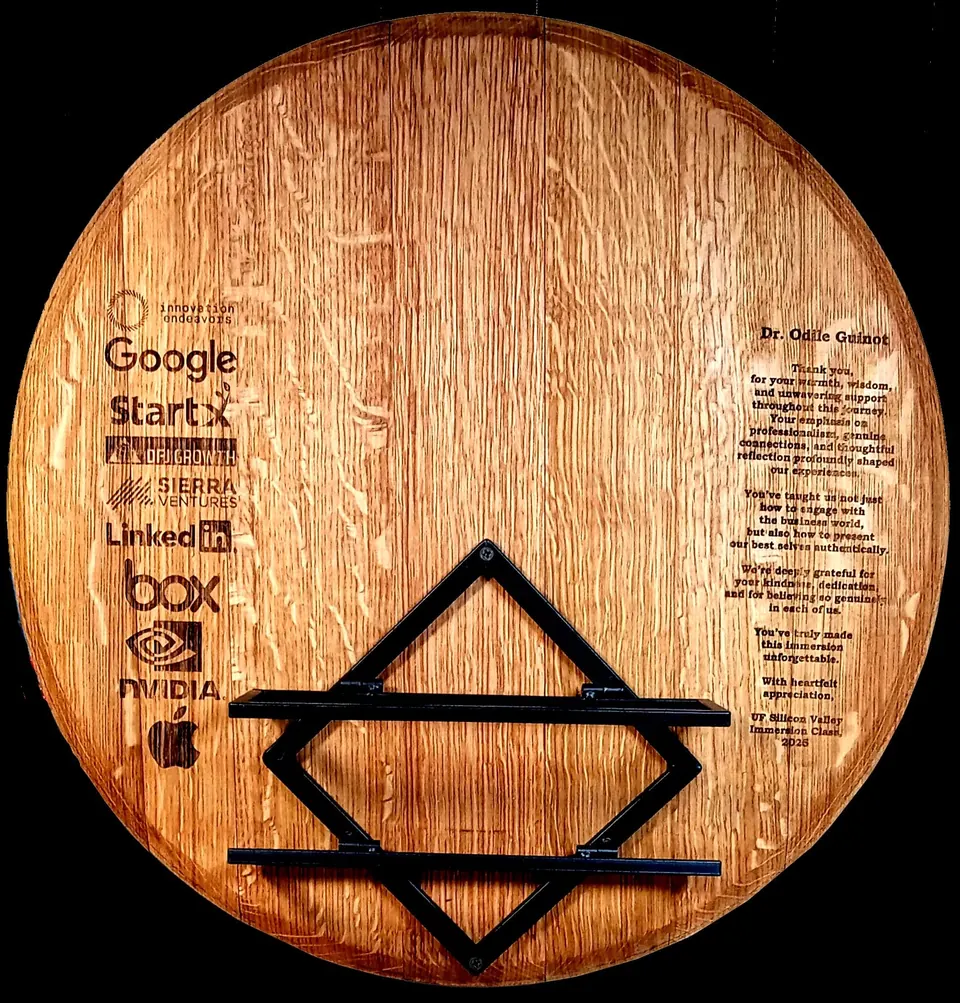 Wood barrel head engraved with company logos