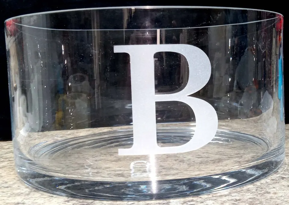 Clear glass bowl engraved with a large letter B monogram