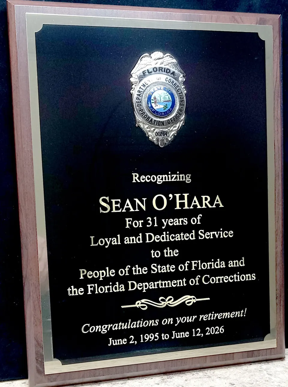Black and gold recognition plaque for 31 years of service