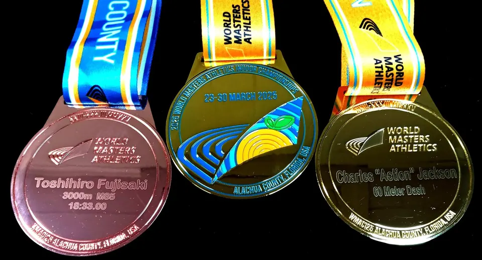 Engraved sports championship medals with ribbons